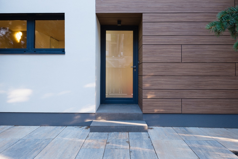 aluminium residential doors and windows in a new build modern house with wood cladding