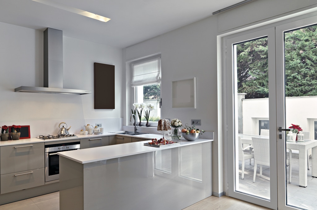 white aluminium french doors next to a matching kitchen window