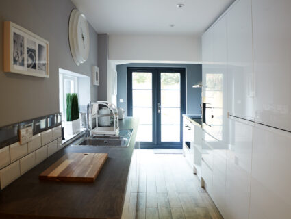 black French doors in a galley kitchen