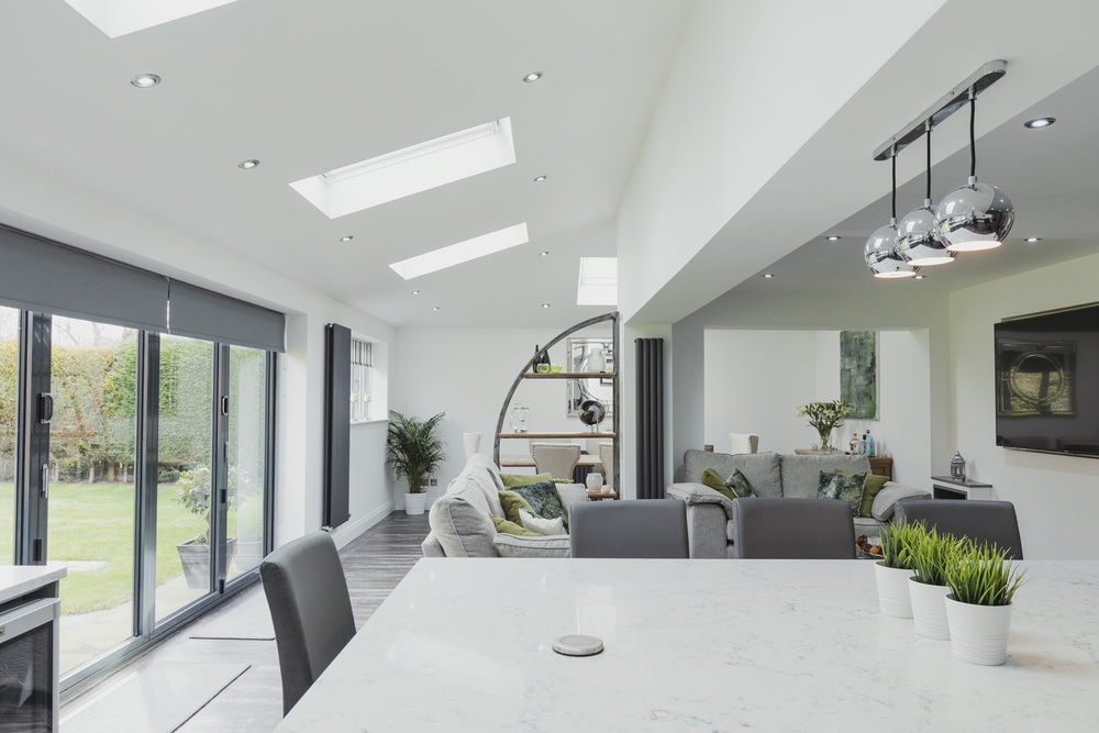 alutech bifolding doors in kitchen extension with grey bifold doors and skylights