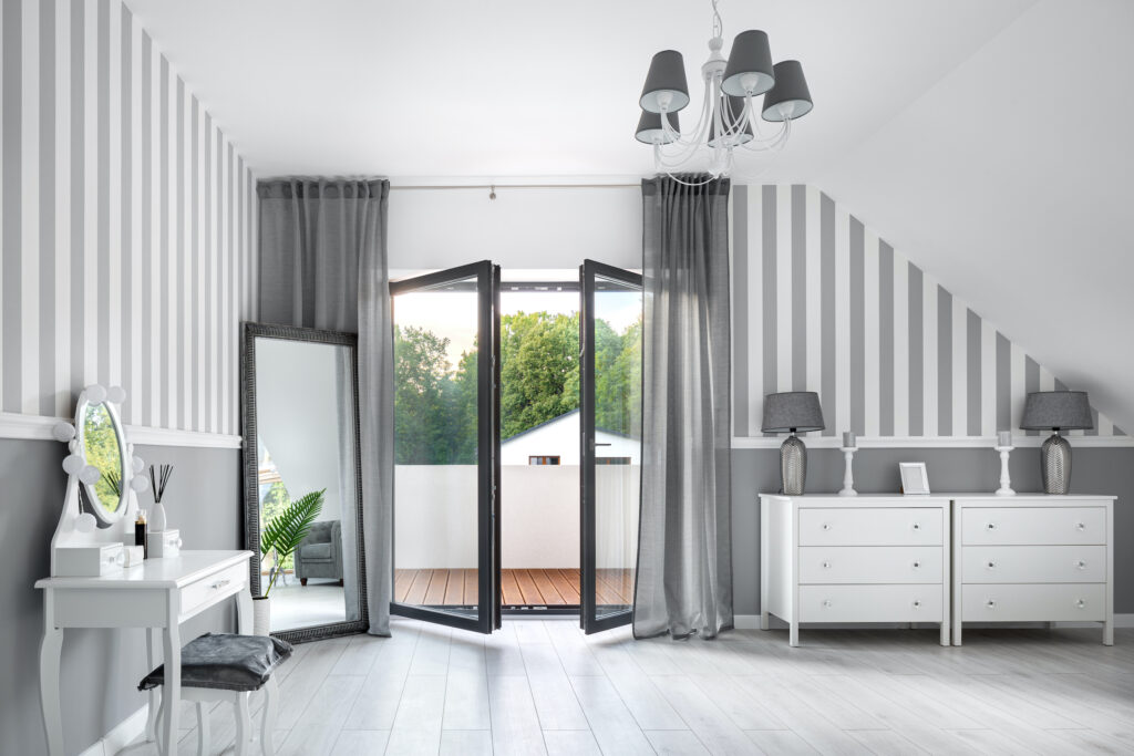 bedroom with opening inwards aluminium French doors