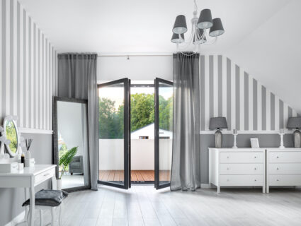 bedroom with opening inwards French doors