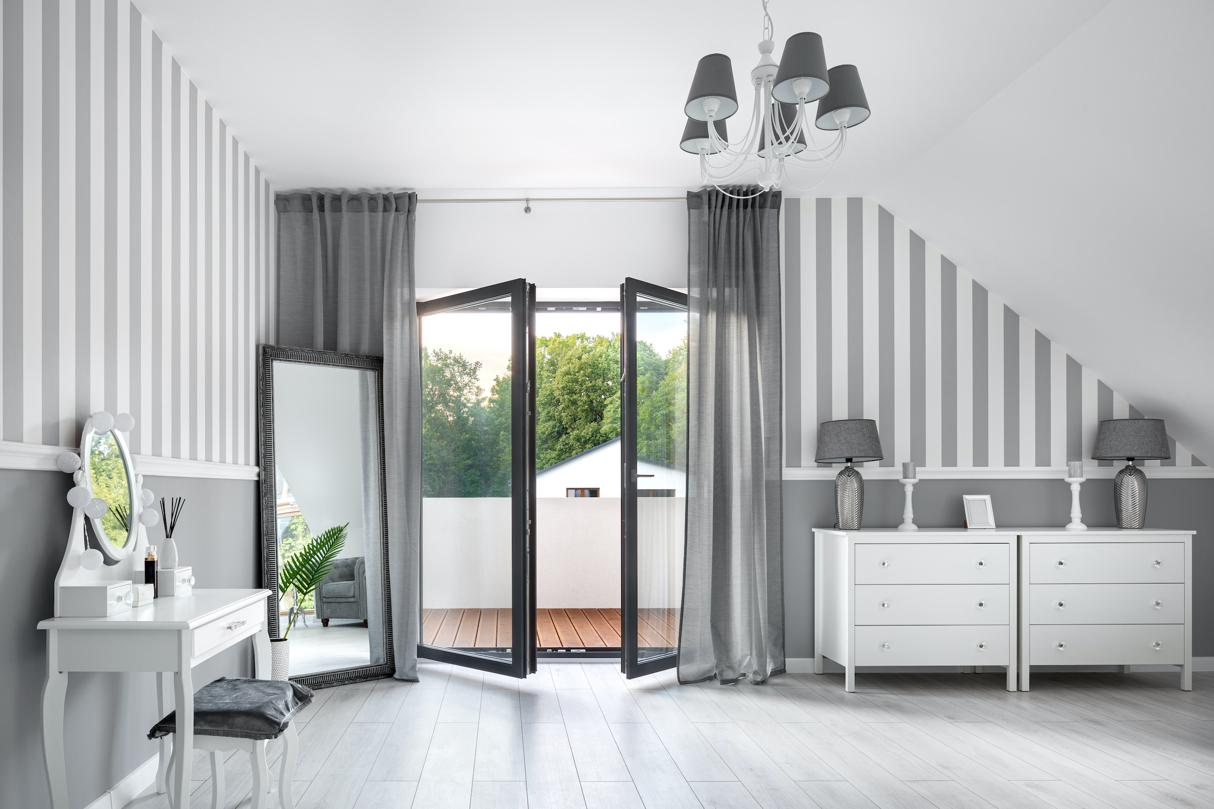 bedroom with opening inwards French doors