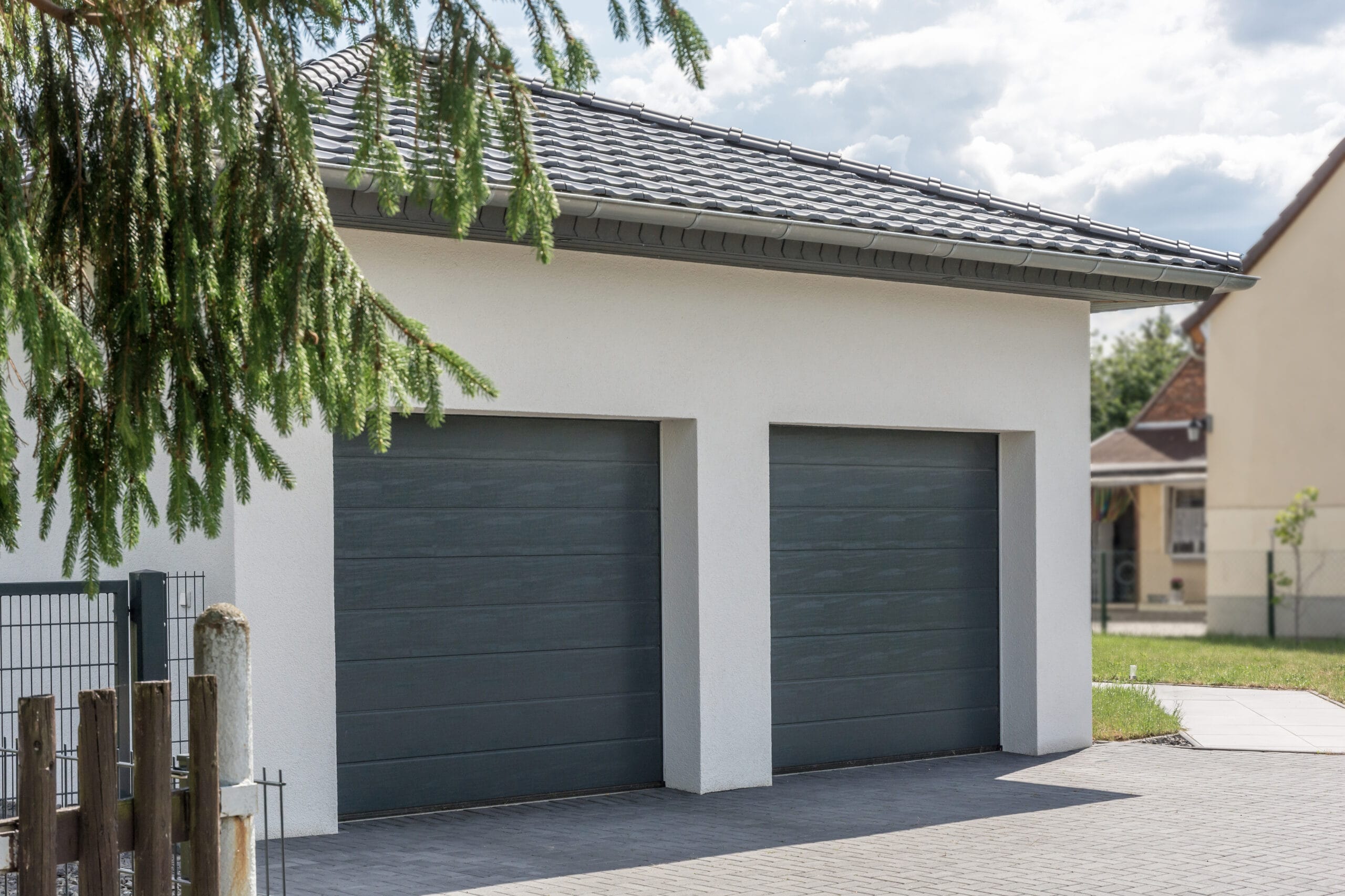 double garage with two sectional garage doors in grey