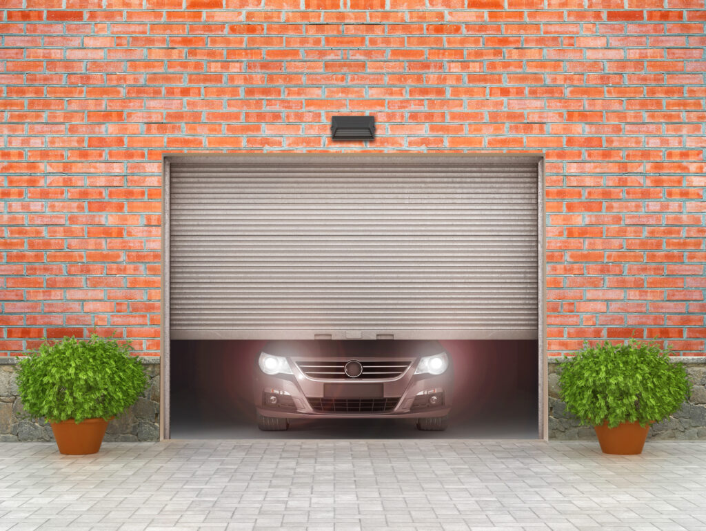 half-open-garage-doors showing alunet garage doors