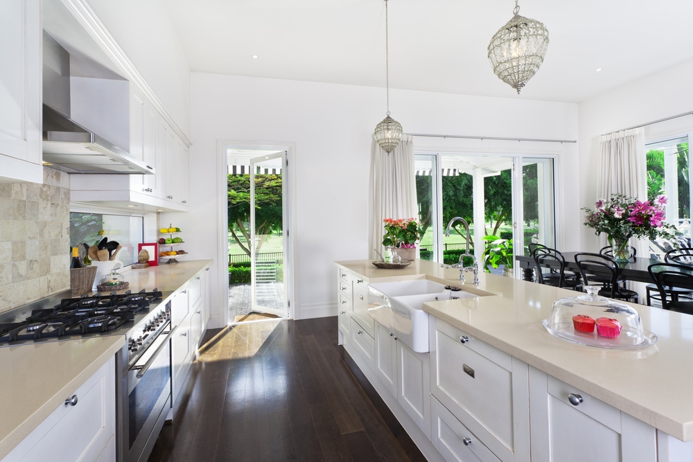 white residential doors in a new kitchen leading to the sunny garden