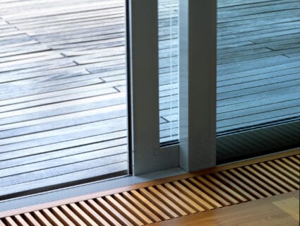 slim sliding doors showing a flush floor and outside decking