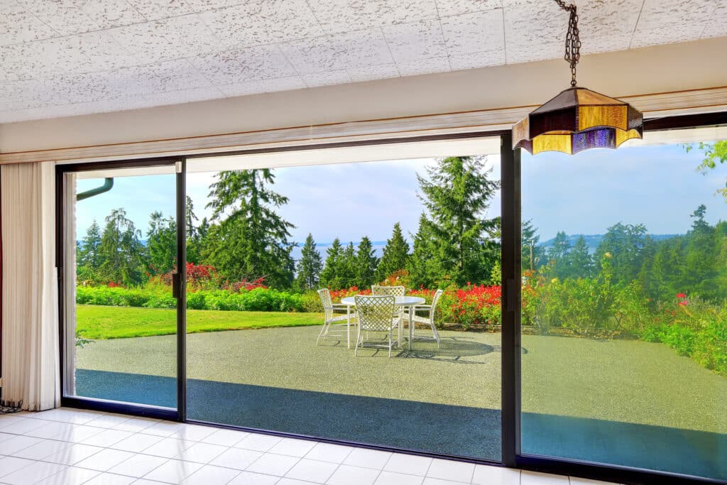 sliding doors fully open showing a large garden