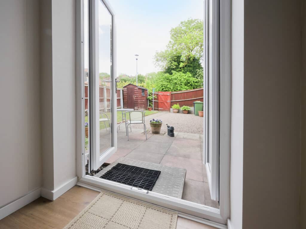 bifold, sliding or French doors showing PVCu french doors open to a patio