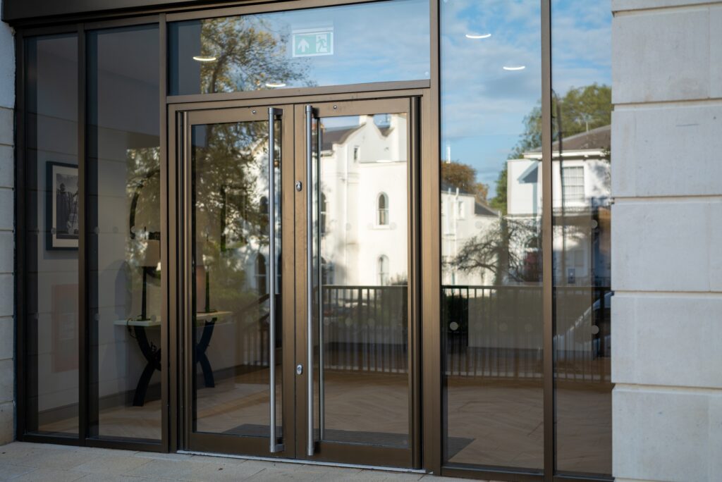 bronze shopfront commercial doors to a hotel entrance. 